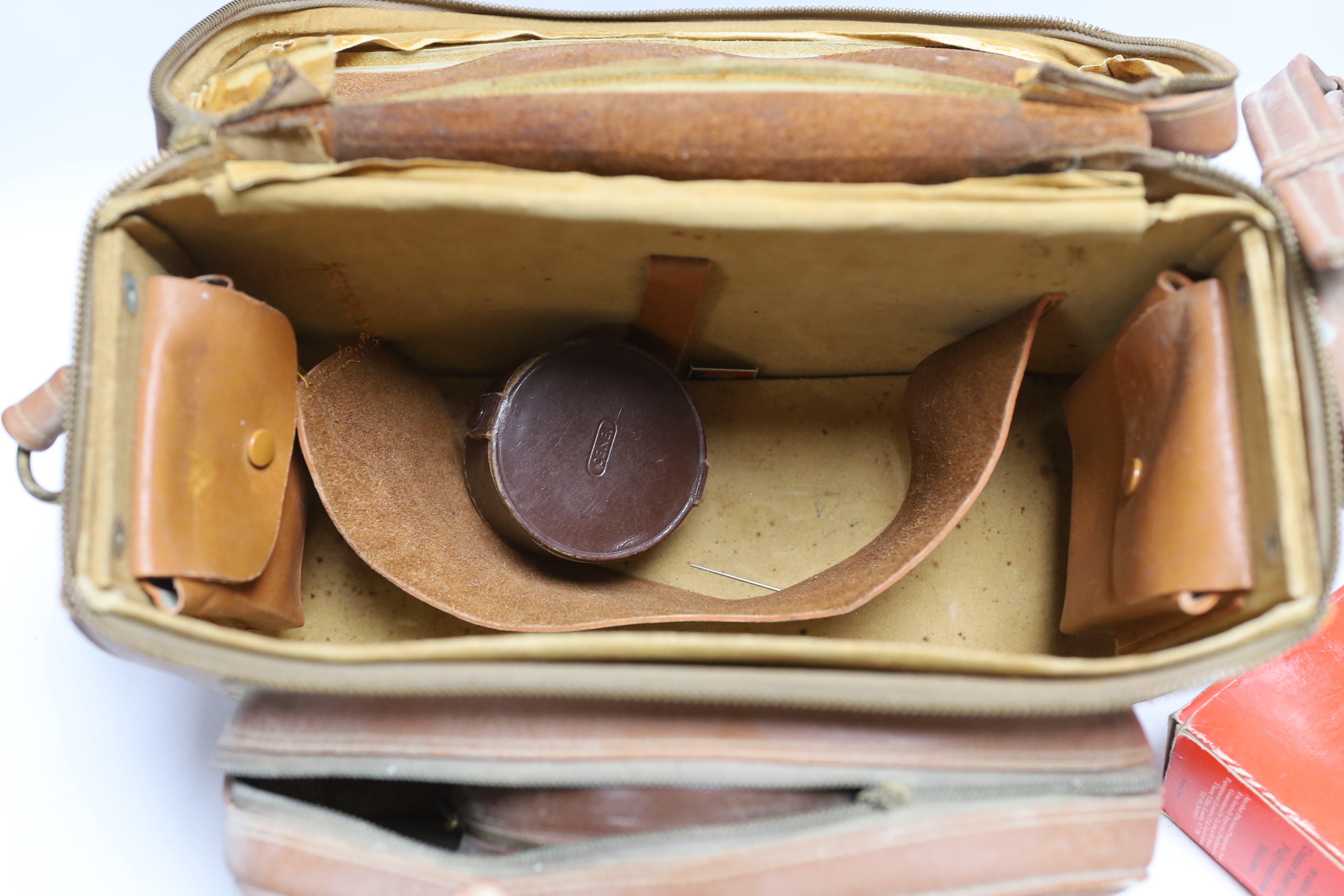A Lordomat leather cased camera, lenses, flashgun, tripod and larger camera case